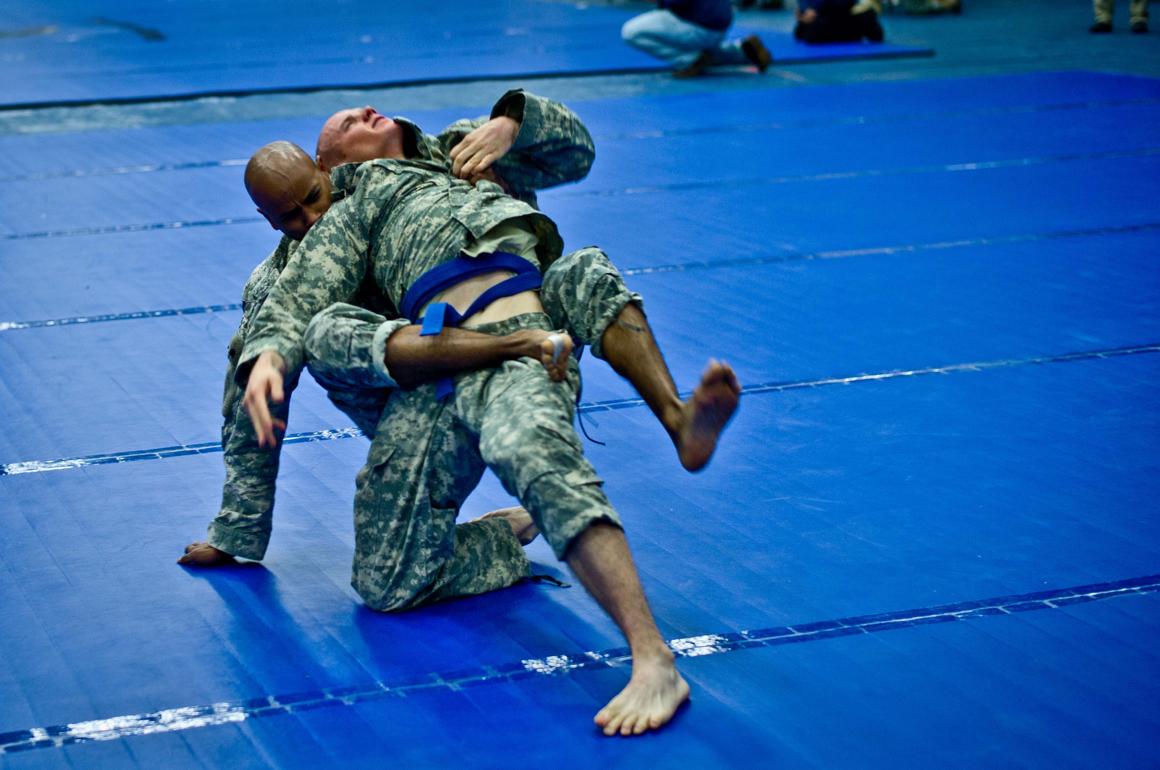 20120213-A-RE761-003: Staff Sgt. Carlos O. Padilla, a civil affairs noncommissioned officer assigned to Headquarters and Headquarters Company, 85th Civil Affairs Brigade attempts to apply a choke hold on his opponent during the 2012 Fort Hood Combatives Championship preliminaries Feb. 13 at the Abrams Physical Fitness Center on base. (Photo by Staff Sgt. Michael J. Dator, 85th Civil Affairs Brigade Public Affairs)