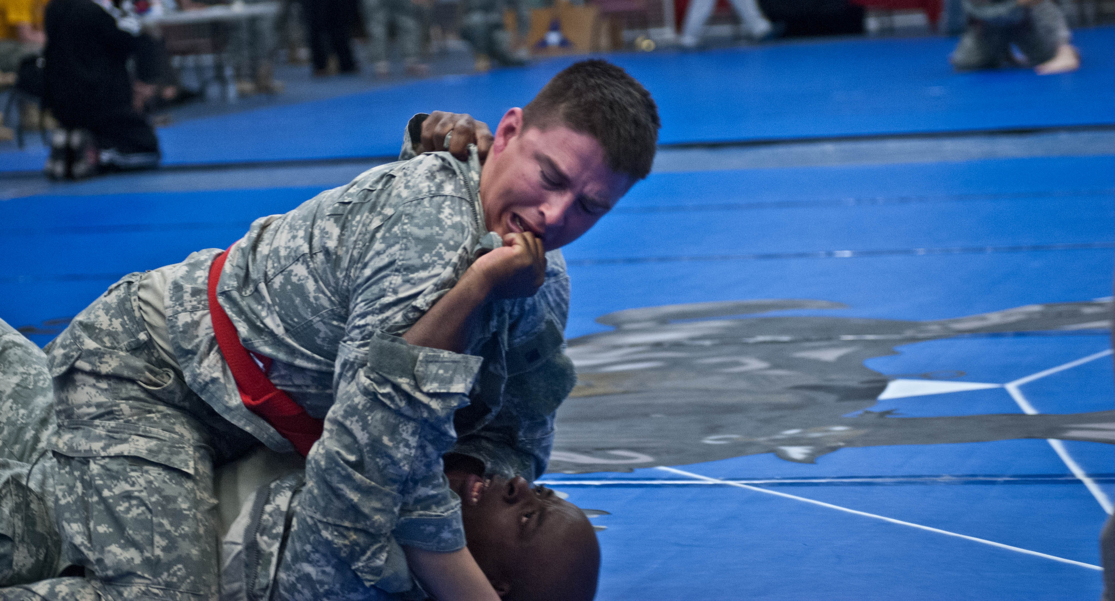 20120214-A-RE761-001: Sgt. 1st Class Jonathon D. Galindo (top), a civil affairs team sergeant assigned to Alpha Company, 81st Civil Affairs Battalion, 85th Civil Affairs Brigade, attempts to apply a choke hold on Sgt. Timothy M. Hardy, a Soldier assigned to Alpha Company, 1st Battalion, 5th Calvary Regiment, 2nd Brigade Combat Team, 1st Calvary Division, during the 2012 Fort Hood Combatives Championship preliminaries Feb. 14 at the Abrams Physical Fitness Center on base. (Photo by Staff Sgt. Michael J. Dator, 85th Civil Affairs Brigade Public Affairs)