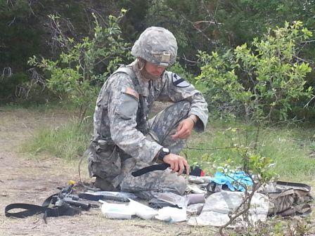 1st CAV DIV SOLDIER CONDUCTS FINAL AID BAG PREPARATION PRIOR TO COMBAT LANE TESTING